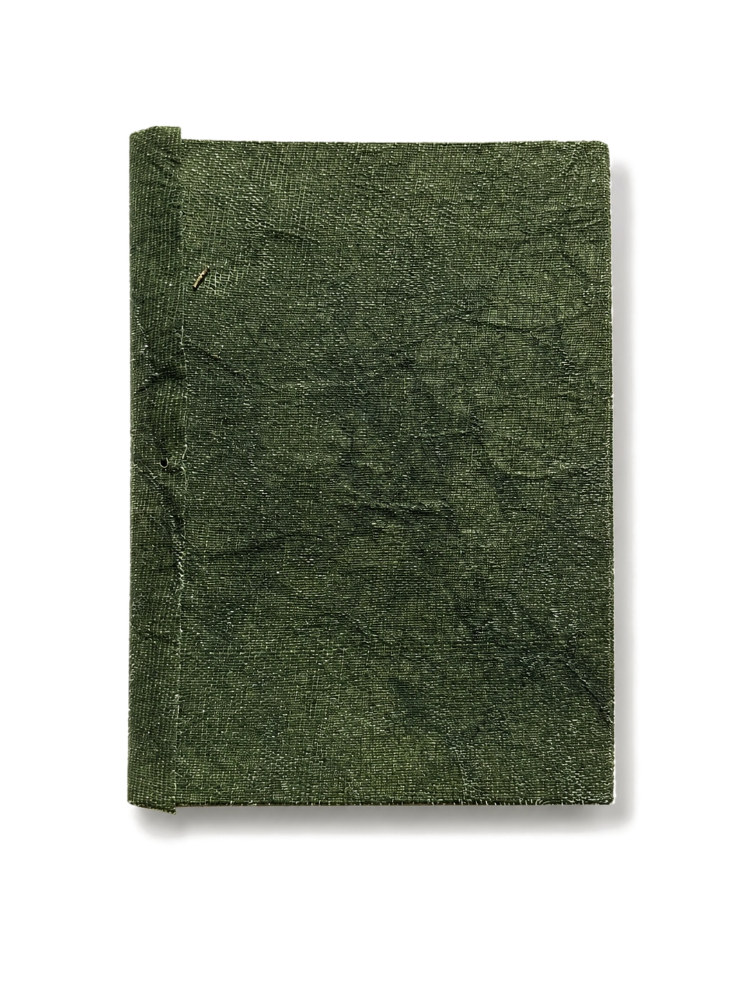 Traces Under Tension — moss-green textile cover, closed.
