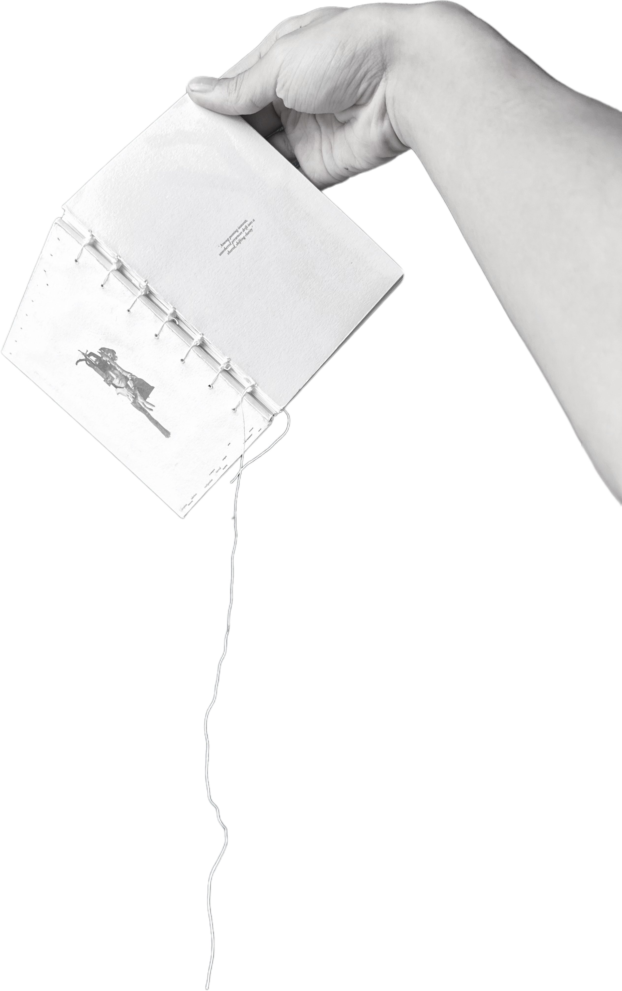 The book held up, exposed binding visible, a thread falling from the spine.